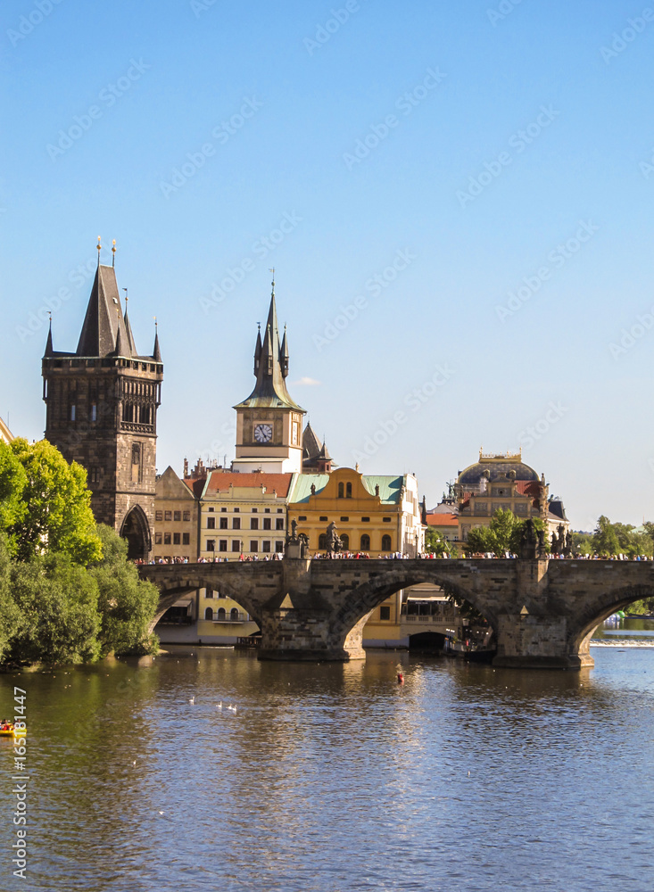 A view of Charles Bridge in Prague in a sunny afternoon