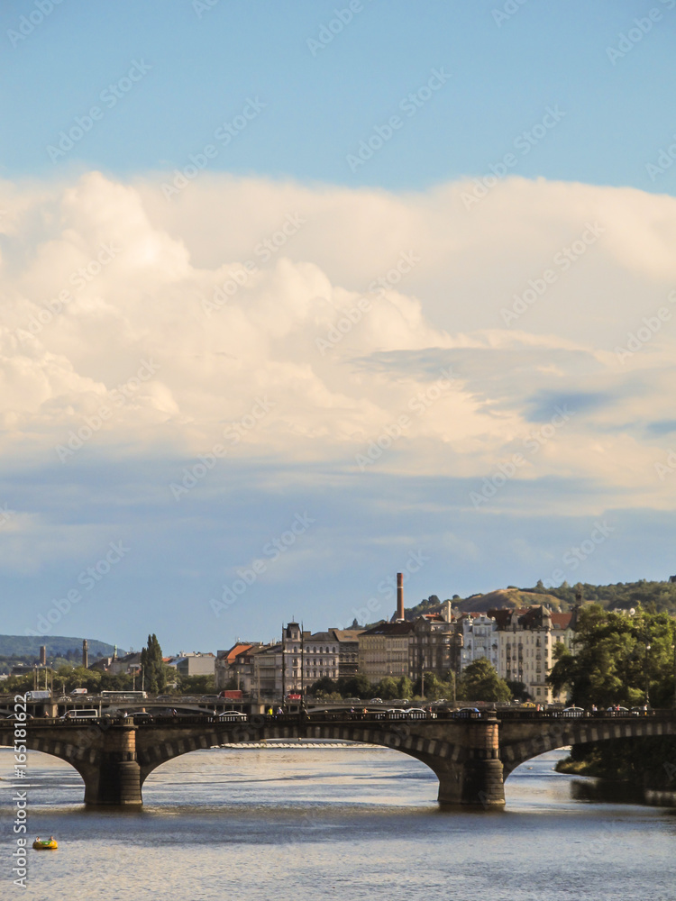 Charles Bridge in Prague with cloudy and blue sky background