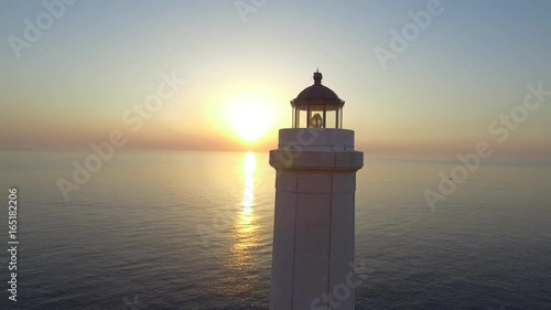 Lighthouse at dawn - aerial view 4k