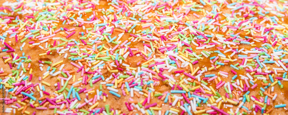 Sugar sprinkle, decoration for cake and bekery, a lot of sprinkles as a background