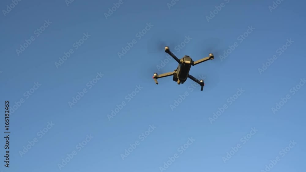 Small quadrocopter flying against the sky Small quadrocopter flying against the sky