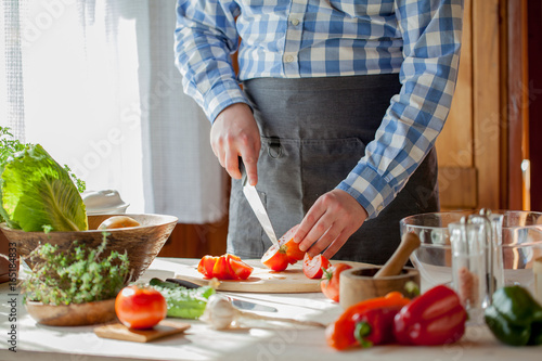 male cooking healthy salad