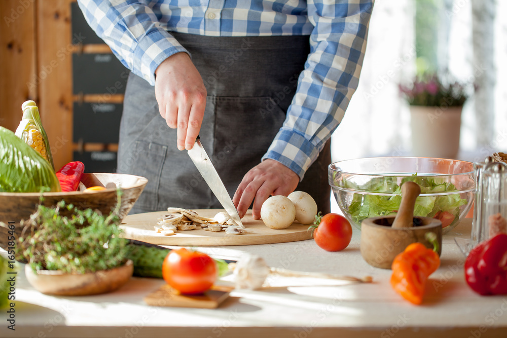 male cooking healthy salad