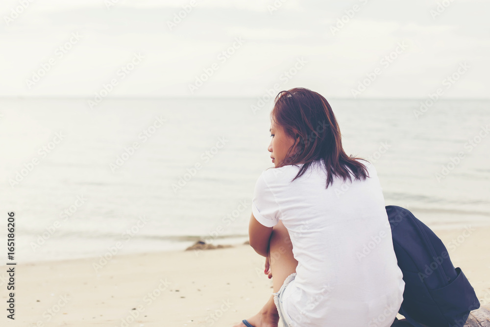 Sad lonely beautiful woman sitting on the pier Sad lonely beautiful woman sitting on the pier
