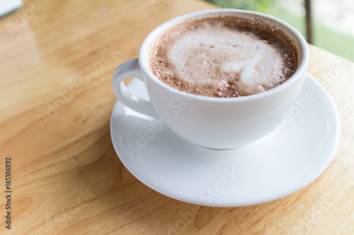 hot coffee mocha with foam milk in countryside cafe