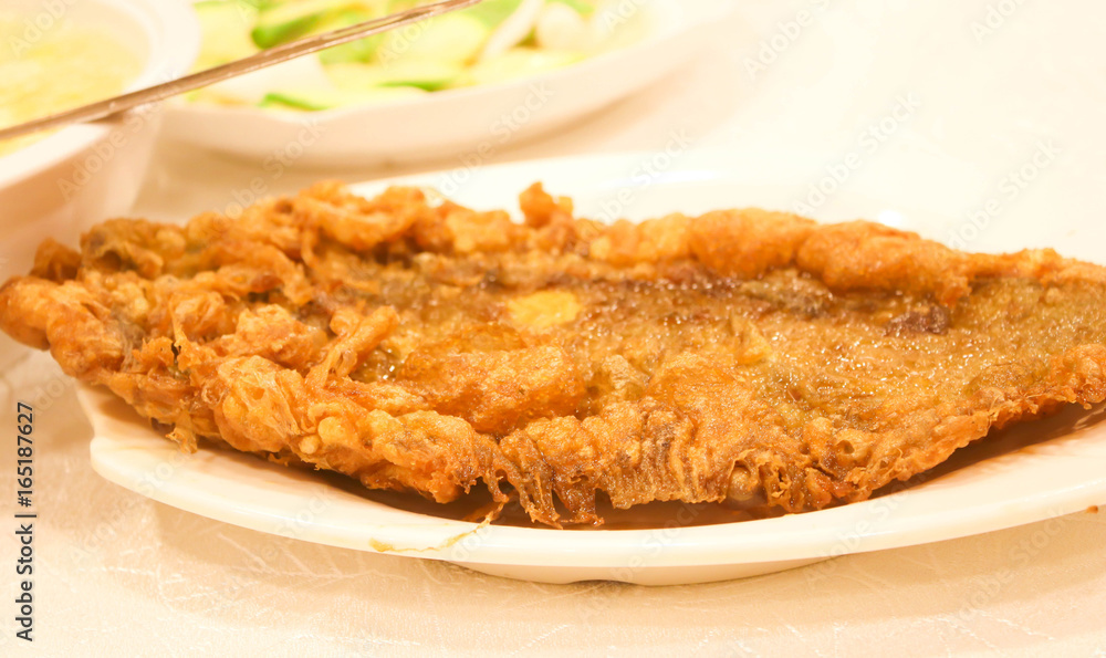 Tasty fish fry on the white on plate Tasty fish fry on the white on plate