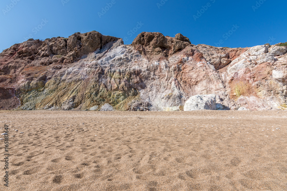 Colourful volcanic rock formations in Paliochori beach of Milos, Greece