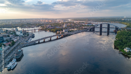 Aerial top view of Dnepr river and Rybalskiy island from above, bridges of Kiev city, Ukraine 