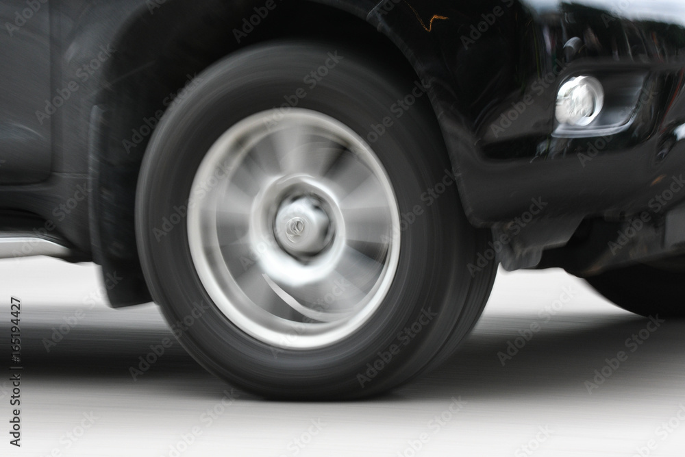 Car moving on streets with rolling wheel Car moving on streets with rolling wheel