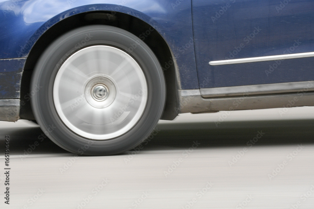 Car moving on streets with rolling wheel Car moving on streets with rolling wheel