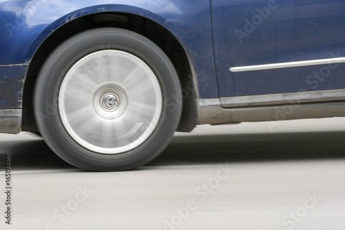 Car moving on streets with rolling wheel © DHstudio