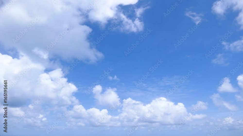 A time lapse of white clouds moving across a blue sky. A time lapse of white clouds moving across a blue sky.