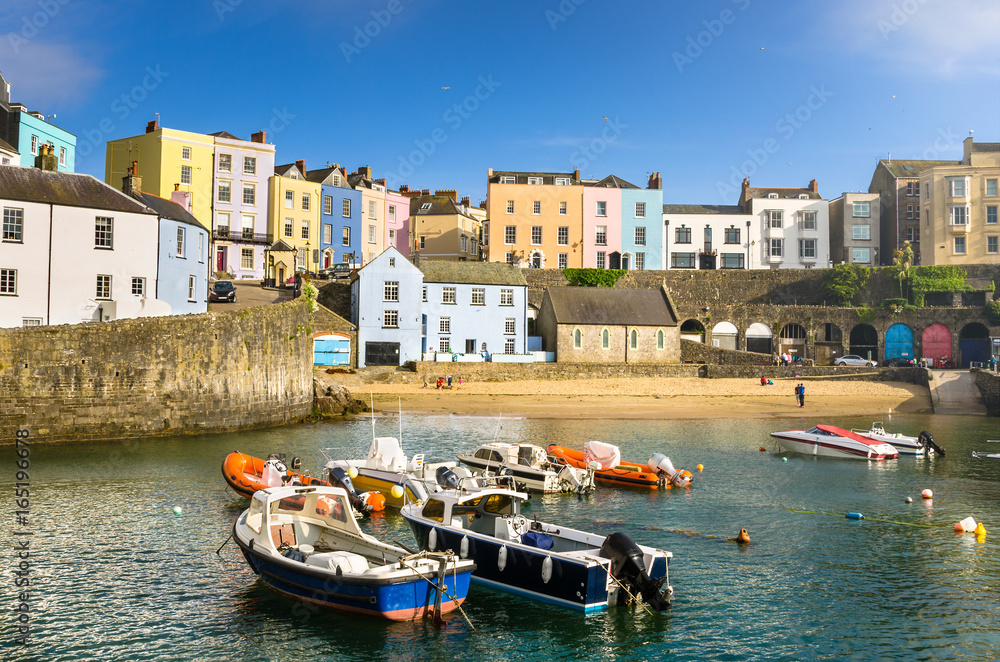 Pastel Coloured Buildings alongside the Harbour in Old Town Tenby, Wales, on a Clear Spring Day