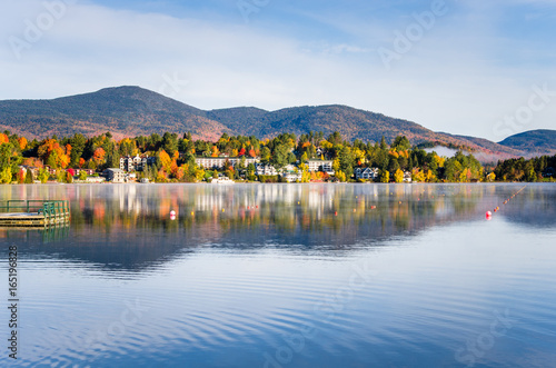 Beautiful Village of Lake Placid from a Foggy Mirror Lake in Autumn at Sunrise