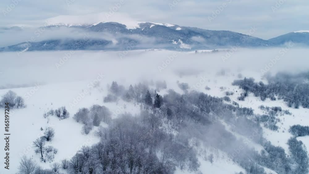 Aerial view in foggy sunset winter mountain Aerial view in foggy sunset winter mountain