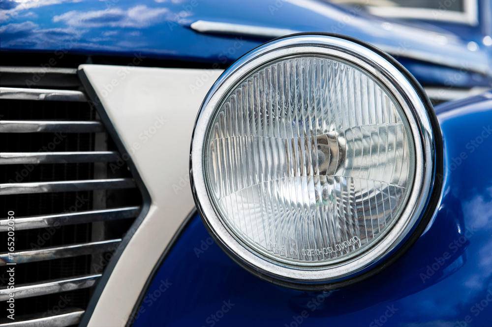 Old car head lights closeup