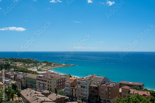 the sea and the rooftops of the city of tarragona