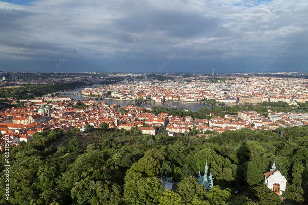 View of the Petrin Hill, Mala Strana (Lesser Town) and Old Town districts and beyond in Prague, Czech Republic, from above.