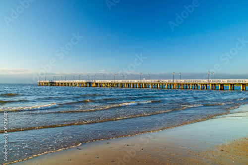 Sunrise with pier at Baltic sea in Gdynia Orlowo.