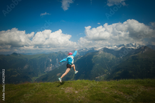 Young woman resting on a mountain hike in the Austrian Alps