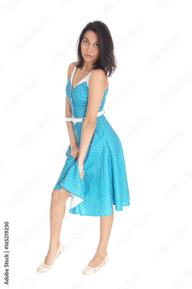 Serious Hispanic woman in blue dress. Serious Hispanic woman in blue dress.