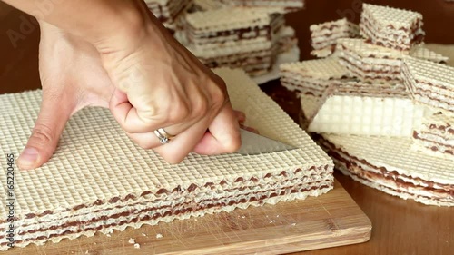 cutting pischinger, oblaten chocolate cake from Poland photo