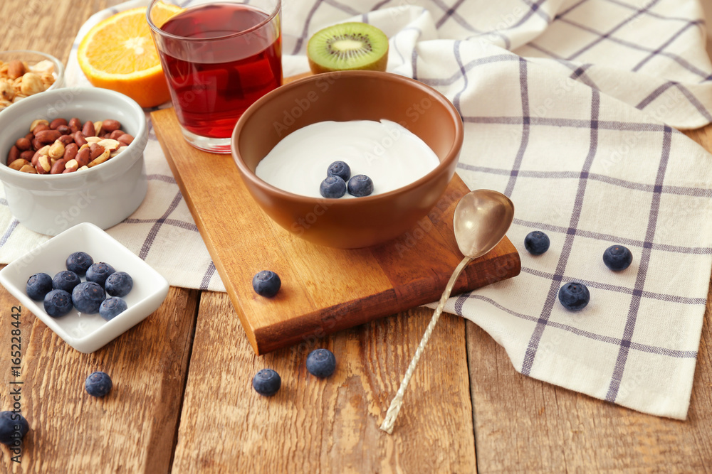 Tasty breakfast with yogurt on table Tasty breakfast with yogurt on table