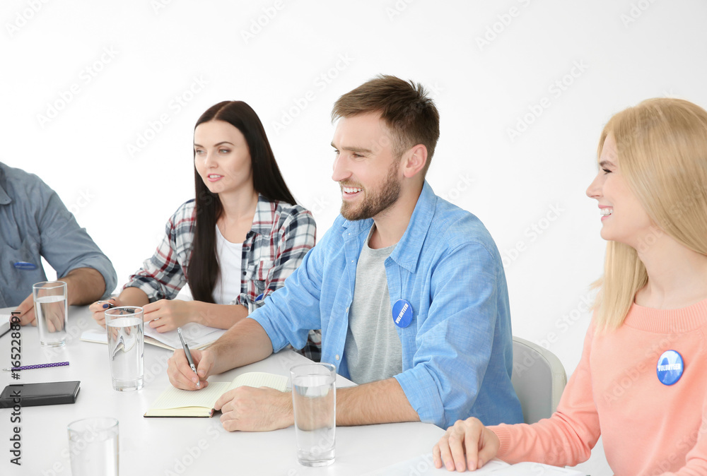 Meeting of young volunteers team in office