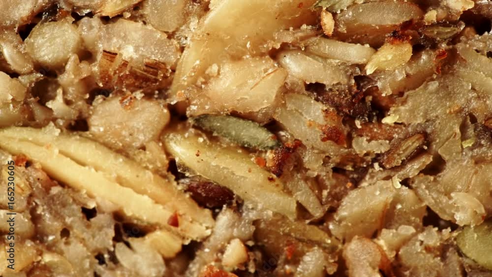 Nobody. Close up of homemade gluten free bread with seeds and nuts. Dolly slider shot 4K ProRes HQ codec Nobody. Close up of homemade gluten free bread with seeds and nuts. Dolly slider shot 4K ProRes HQ codec