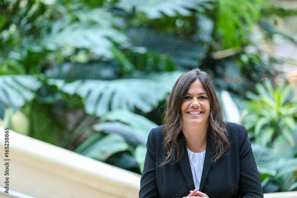 Business Woman in Hotel Garden Business Woman in Hotel Garden