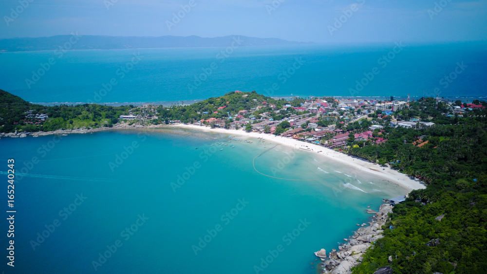 Aerial view from the drone on the taxi boats at the azure sand beach of Thailand,koh Phangan island,Haad Rin beach