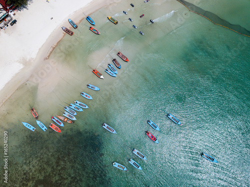 Aerial view from the drone on the taxi boats at the azure sand beach of Thailand,koh Phangan island photo