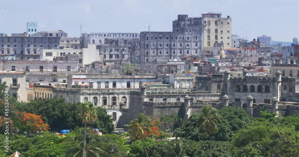 A high angle daytime establishing shot of old buildings near the Havana Port Bay in Cuba. A high angle daytime establishing shot of old buildings near the Havana Port Bay in Cuba.