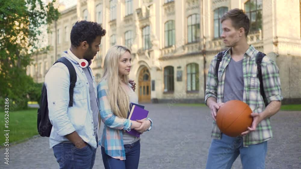 Male student flirting with his friend's girlfriend, cheating in relationship