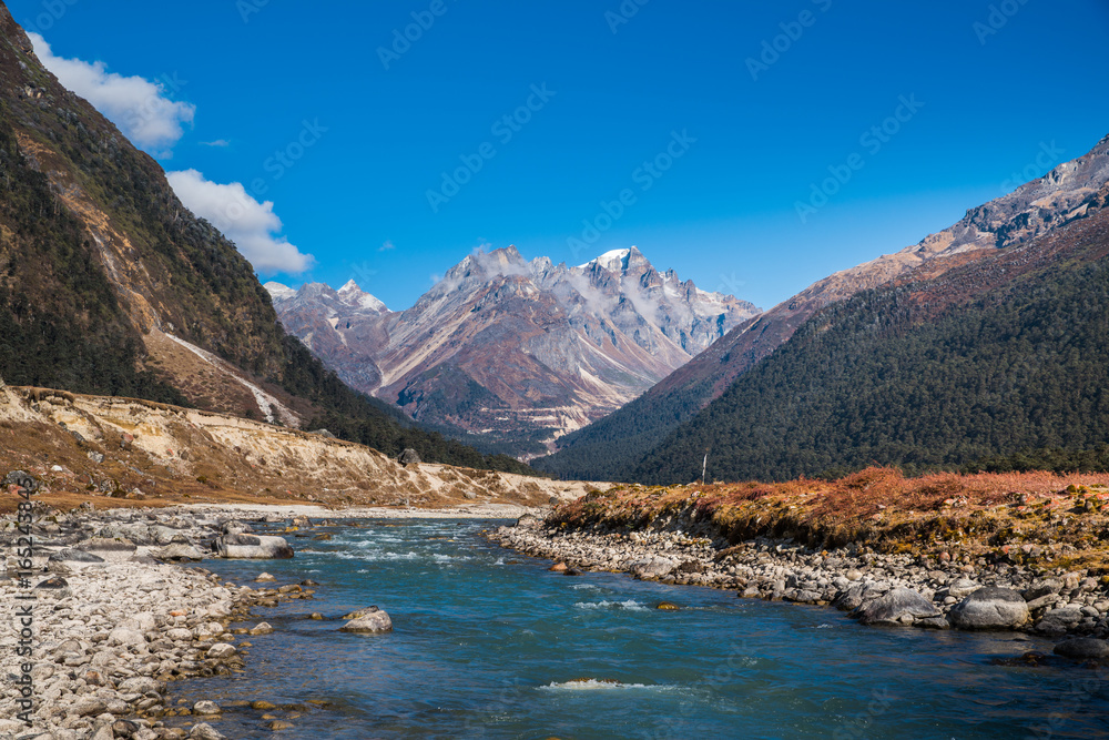 River from ice melt on mountain Landscape view at Lachung, clear weather day time