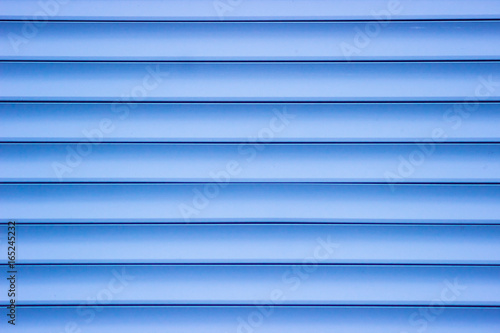 Blue plastic panel siding texture.
