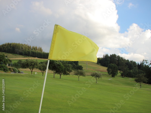 Yellow Windy Flag at Golf Course on Mountain