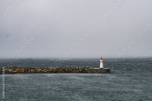 Lighthouse bracing against the storm