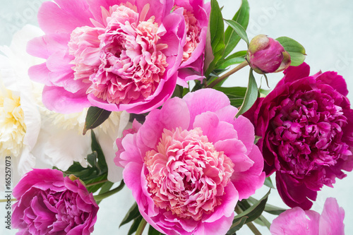 Peonies. Beautiful bouquet of pink white and purple peonies in vase on bright background. Closeup shot selective focus. Wedding bouquet  Happy Mothers day gift  women s day gift  Greetings card 