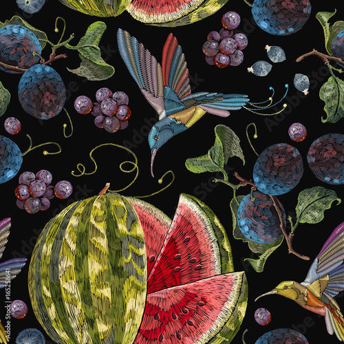 Embroidery hummingbirds, plum, grapes watermelon seamless pattern. Beautiful classical embroidery tropical birds  humming bird fruit watermelons and  blossoming plum summer seamless pattern