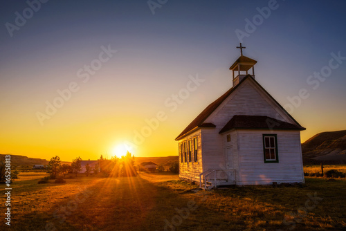 Canvas Print Sunset over the old church in the ghost town of Dorothy