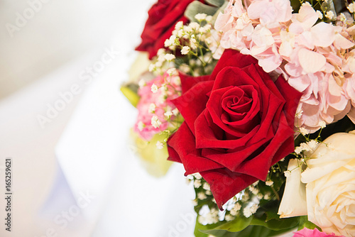 Red and white roses bouquets at weddings and celebrations, copy space.
