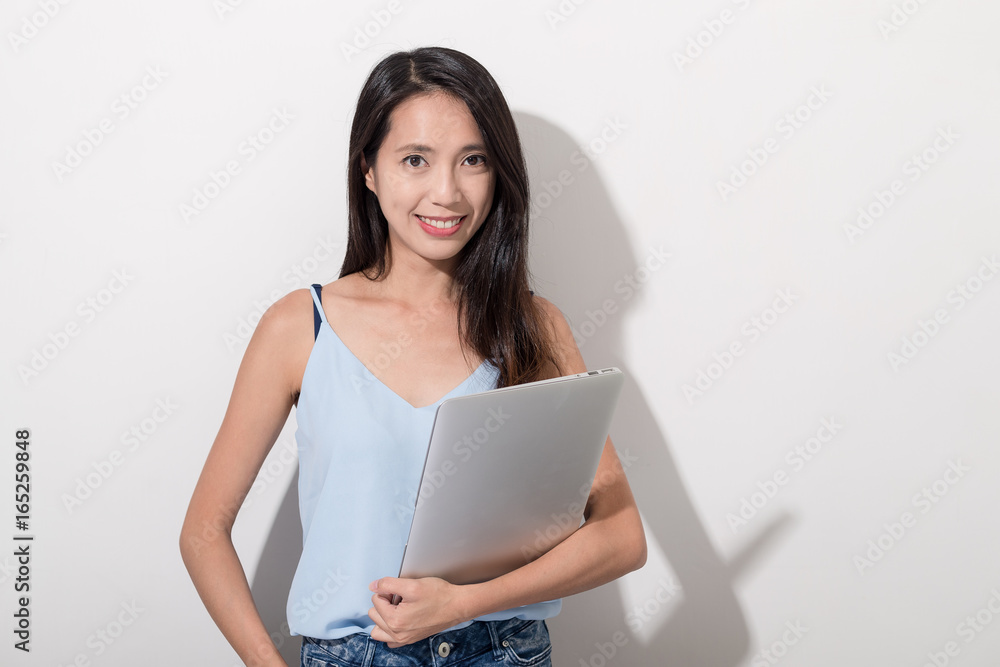 Woman holding with notebook computer Woman holding with notebook computer