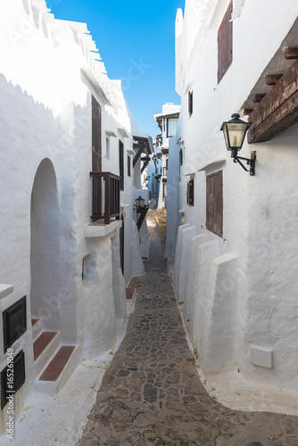 Narrow streets of the village in Menorca. Spain photo