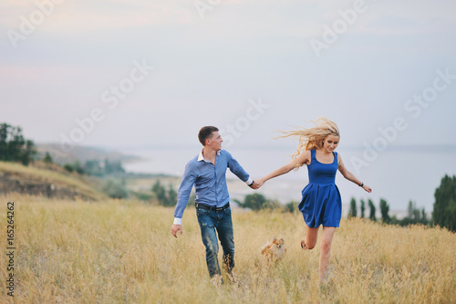 Young couple: the guy and the girl on walk, love story © oes