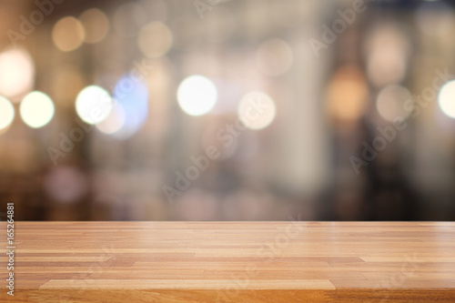 Empty wooden table and blur interior background