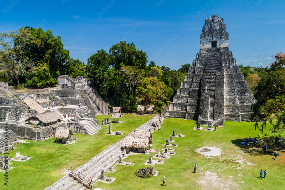 TIKAL, GUATEMALA - MARCH 14, 2016: Tourists at the Gran Plaza at the archaeological site Tikal, Guatemala