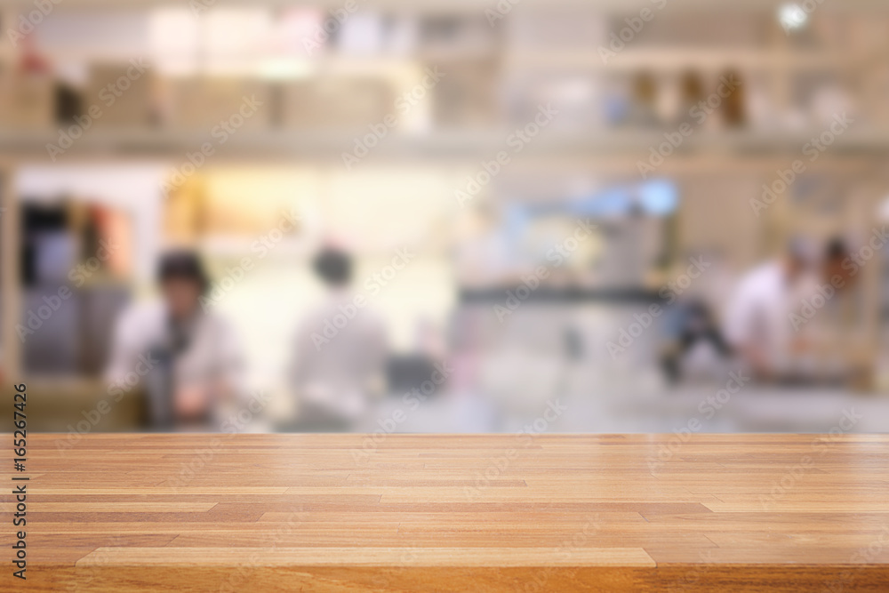 Empty wooden table and blurred  modern kitchen cafe background
