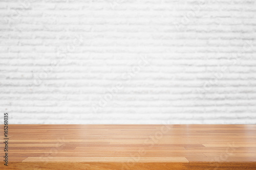 Empty wood table top with white blur  brick wall background