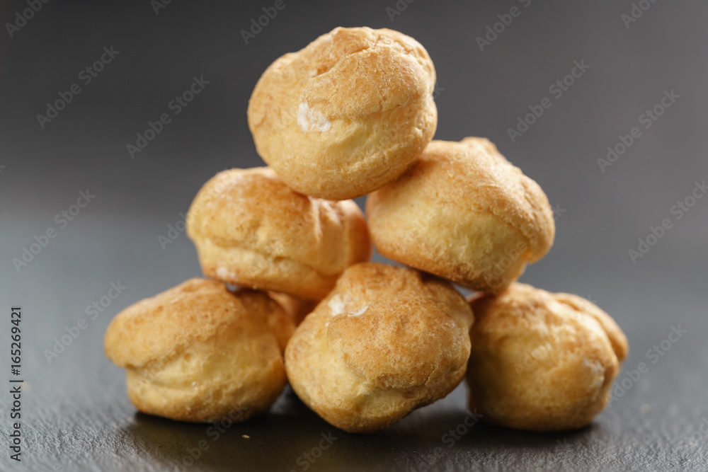 profiteroles on slate background closeup profiteroles on slate background closeup